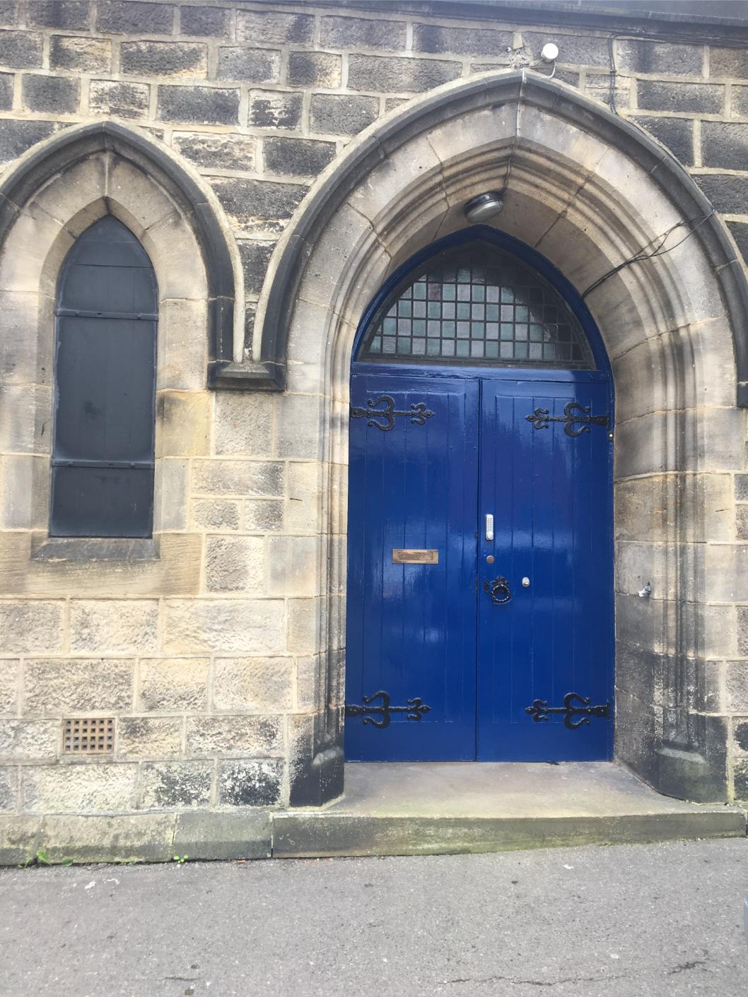 The blue double doors of the library on Chapel Street